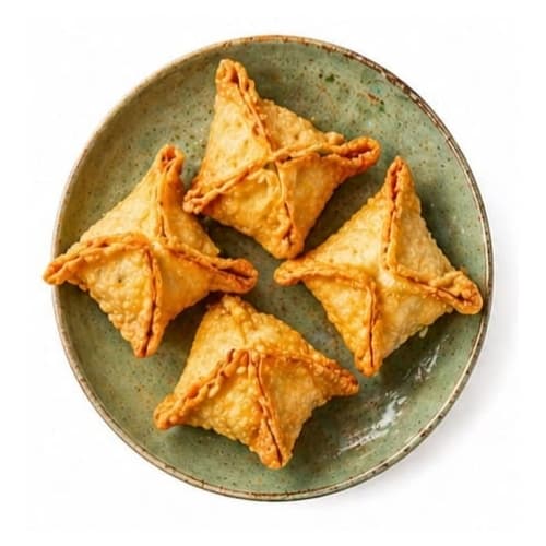 Triangle-shaped crab rangoon on a plate